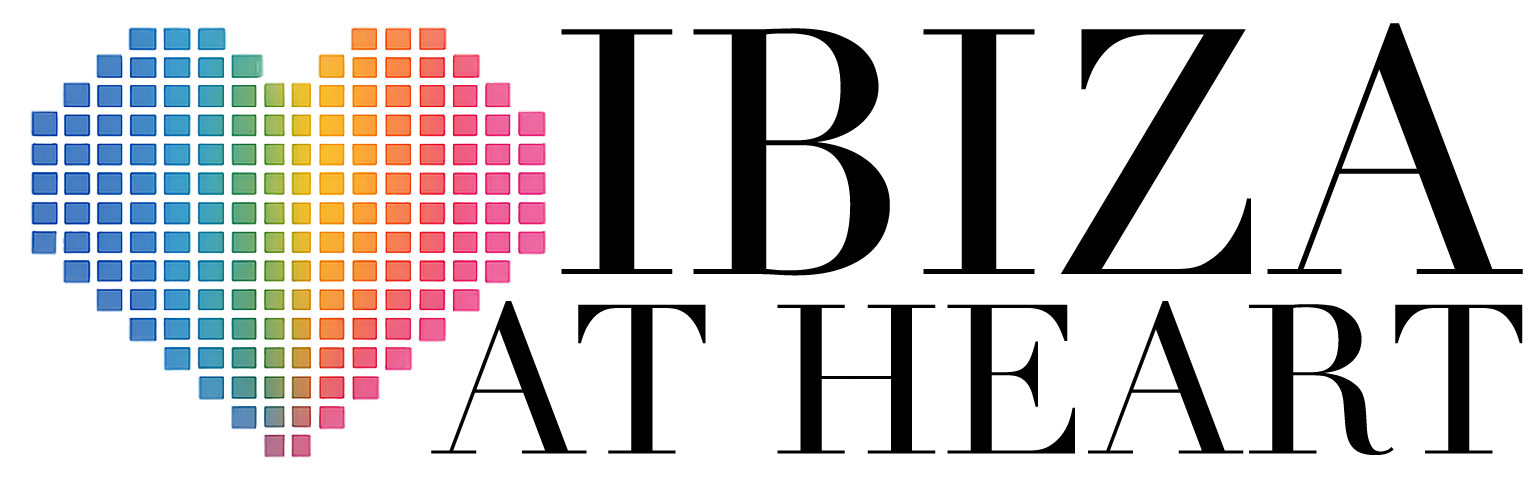 Logo with a pixelated heart in rainbow colors next to black text reading 'IBIZA AT HEART'.